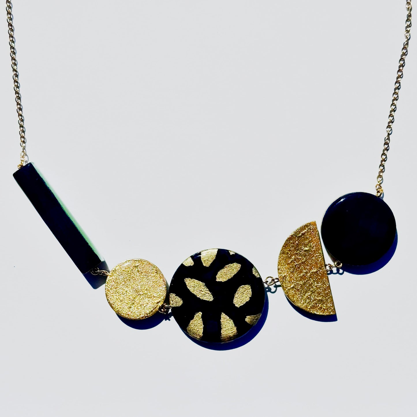 Twist ‘N’ Go Green Gold Hand-Painted Transforming Wooden Necklace – Multi-Shape Statement Piece