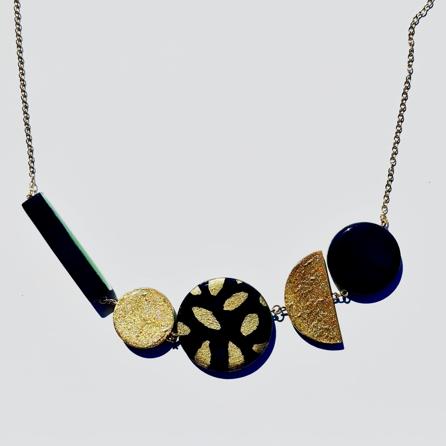 Twist ‘N’ Go Green Gold Hand-Painted Transforming Wooden Necklace – Multi-Shape Statement Piece