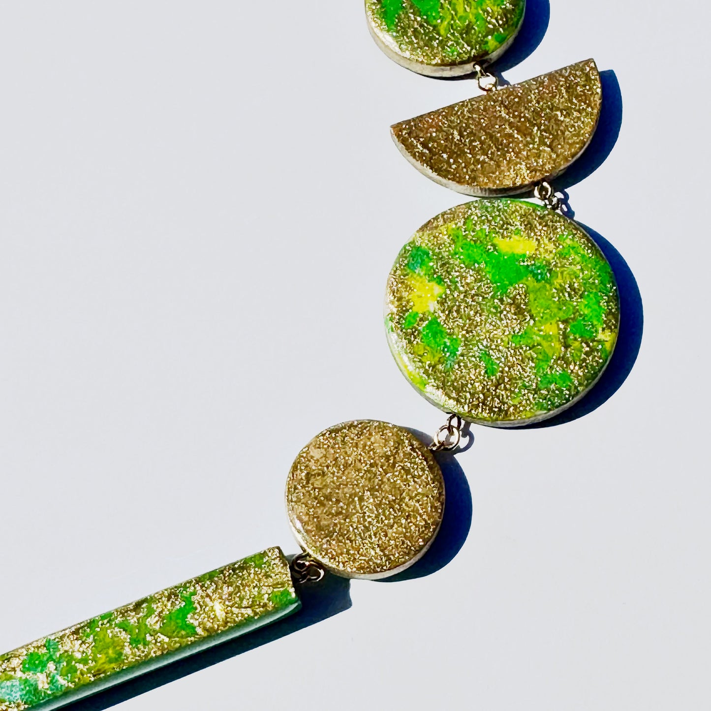 Twist ‘N’ Go Green Gold Hand-Painted Transforming Wooden Necklace – Multi-Shape Statement Piece