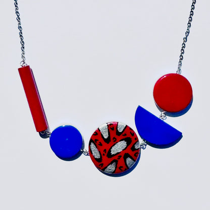 Twist ‘N’ Go Red Blue Hand-Painted Transforming Wooden Necklace – Multi-Shape Statement Piece