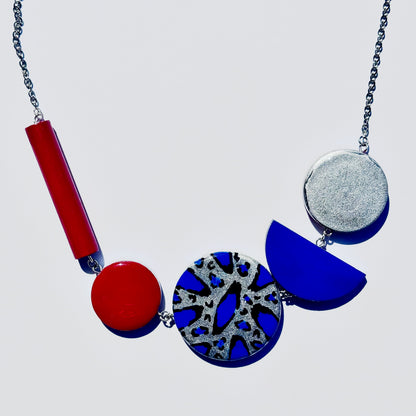 Twist ‘N’ Go Red Blue Hand-Painted Transforming Wooden Necklace – Multi-Shape Statement Piece