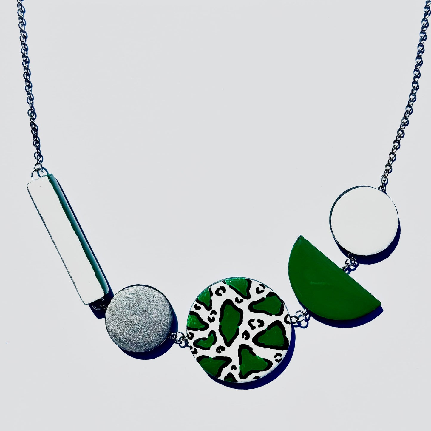 Twist ‘N’ Go Green White Hand-Painted Transforming Wooden Necklace – Multi-Shape Statement Piece