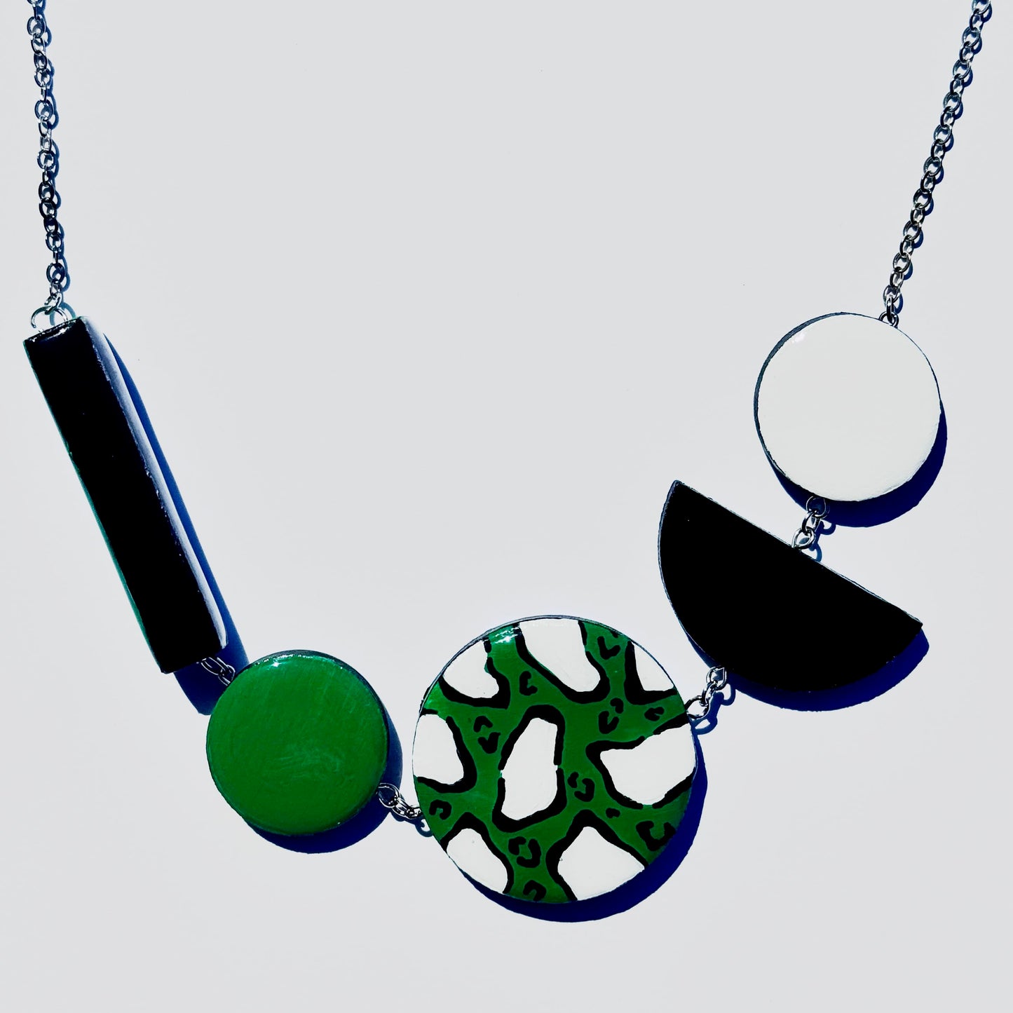 Twist ‘N’ Go Green White Hand-Painted Transforming Wooden Necklace – Multi-Shape Statement Piece
