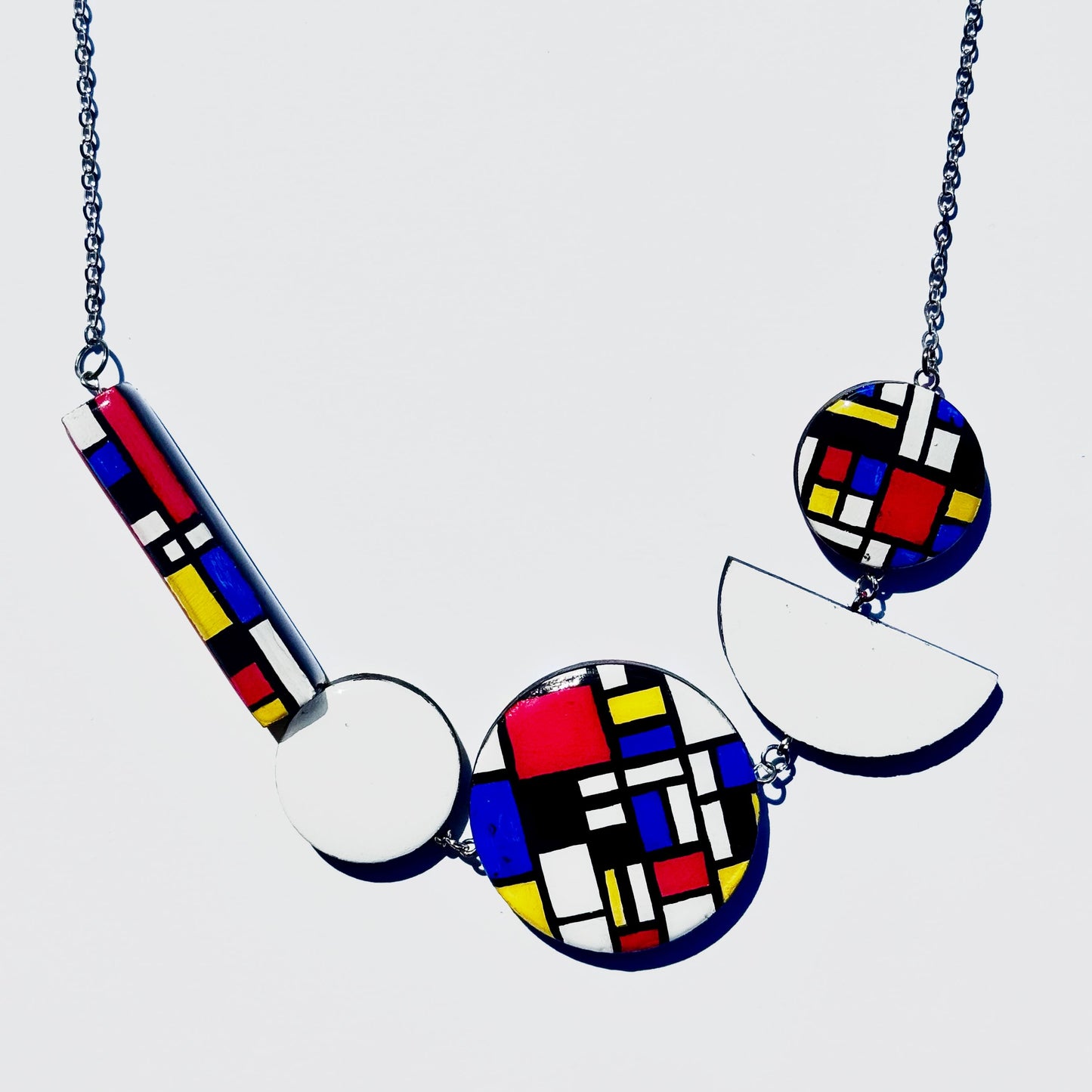 Twist ‘N’ Go Mondrian Hand-Painted Transforming Wooden Necklace – Multi-Shape Statement Piece